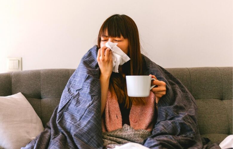 lady with a blanket around her with a cold